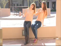 Sexy twin sisters gets naked while in a public place